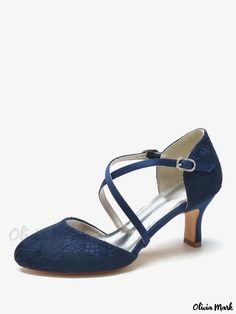 a women's blue shoe with straps and heels on the heel are made from satin fabric