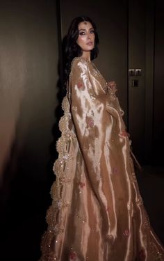 a barbie doll dressed in a gold gown