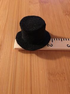 6.00 USD Mini black top hat. 2” brim diameter, 1” diameter opening . Fits on a lollipop. Price is for one hat. Navy Blue Top Hat Tree With Flower, Making Miniature Hats, Adjustable Black Top Hat As A Gift, Adjustable Black Top Hat Gift, Black Brimmed Hat As A Gift, Wine Bottle Topper, Black Top Hat, Bottle Toppers, Mini Top Hat