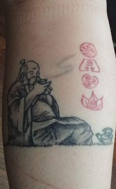 a tattoo on the leg of a person with an image of a man and woman