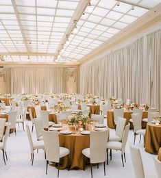 an instagram photo of a banquet hall with tables and chairs set up for formal function