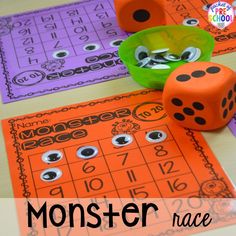 some dices and numbers on a table with the words monster race in front of them