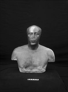 an ancient bust of a man in black and white