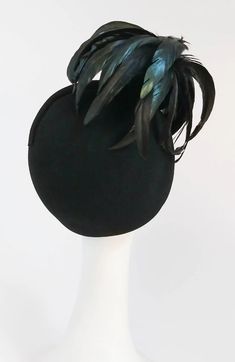 For Sale on 1stDibs - 1980s Mr. John Rooster Feather Hat. A spray of feathers articulate this elegant black wool hat. Evening Feathered Hat Headpiece, Evening Hat With Feathers, Evening Feather Hat Headpiece, Evening Mini Hat With Feathers And Short Brim, Evening Costume Hat With Feathers, Fitted Black Top Hat With Feathers, Black Feather Trim Hat For Kentucky Derby, Black Feathered Hats For Kentucky Derby, Black Feathered Costume Hats For Kentucky Derby