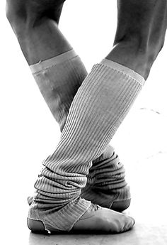 black and white photograph of feet with socks on