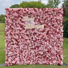 a large pink flowered wall with the words rose mommy on it's side