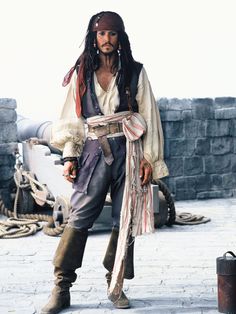 a man dressed as captain jack sparrow on the set of pirates