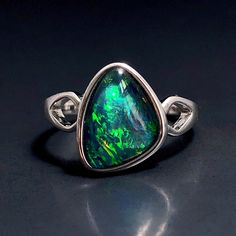 "Natural Australian black Opal triplet Sterling Silver Ring, one-off piece of natural opal set in sterling silver in a modern design.  Please note: All my Australian black Opals are one-off pieces so some rings will need to be resized to your size once the order is placed, please allow 4-5 working days for me to change the size for you.  Made of solid British Sterling Silver with rhodium plating.  Rhodium-plated silver is fine sterling silver that is polished and dipped in rhodium. It has a brig Mf Doom Ring, Natural Opal Ring, Australian Black Opal, Cosmic Consciousness, Rings Black, Unusual Rings, Jewellery Ideas, Cabochon Ring, October Birthstone