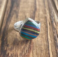 "Rainbow Calsilica Sterling Silver Ring US Size 8 Rainbow Calsilica was mined in Mexico and is 13x13mm Top of ring is 5/8\" by 5/8\" 4.6g Sterling Silver, stamped 925 *Check out my shop for one of a kind, handmade pieces that feature genuine gemstones and Sterling Silver. I love to work with unique rare gems mined in the US to support American Miners. I personally hand pick each and every single stone used in my designs. *I have been in the jewelry business for over twenty years and enjoy the pr Multicolor Cabochon Rings For Anniversary, Multicolor Inlay Rings For Anniversary, Anniversary Multicolor Inlay Rings, Multicolor Multi-stone Rings For Gift, Multicolor Turquoise Round Ring For Anniversary, Multicolor Natural Stone Rings For Anniversary, Multicolor Turquoise Ring For Anniversary, Multicolor Nickel-free Jewelry For Anniversary, Adjustable Rainbow Gemstone Ring