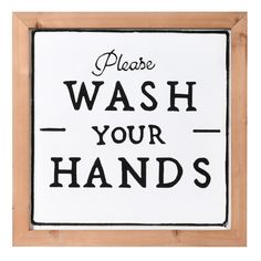 a black and white sign that says please wash your hands on the side of a wooden frame