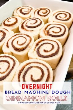 cinnamon rolls in a white baking dish with the title overlay reading overnight bread machine dough cinnamon rolls