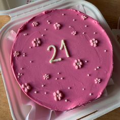 a pink cake with the number twenty two on it