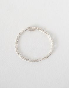 Stand-alone or stack with others, this lightweight vintage charmer of a bracelet will effortlessly complete every ring set. PRODUCT DETAILS 3.5MM FIGARO CHAIN BRACELET WITH LOBSTER CLASP INDIVIDUALLY HANDCRAFTED-TO-ORDER JUST FOR YOU semi-custom & zero-waste ethically sourced fabricated in our Bellingham, WA studio MADE WITH RECYCLED PRECIOUS METALS REFINED IN U.S. nickel-free & hypoallergenic good for everyday wear & easy care > WE ADD 1/2" TO WRIST MEASUREMENT TO ENSURE COMFORTABLE FIT SHIPPIN Mailer Box Packaging, Key Bracelet, Bellingham Wa, Figaro Chains, Figaro Chain, A Bracelet, Zero Waste, Delicate Bracelet, Sterling Silver Bracelets