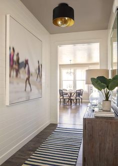 the hallway is clean and ready for guests to use it as an entrance way in this home