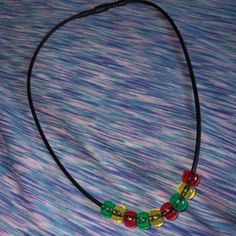 New Rastafari Necklace Han With Hypoallergenic Materials Silicone Cord Has A Closure That Opens/Closes Bright Red Yellow And Green Beads Bundle To Save Money Contact Me If You Have Any Questions Check Out My Closet Amorefinds For More Great Items Casual Red Beaded Chain Jewelry, Casual Multicolor Jewelry With Black Beads, Casual Adjustable Large Beads Necklace, Casual Red Round Beaded Necklaces, Casual Red Beaded Necklace, Casual Adjustable Beaded Chain Necklace, Casual Red Jewelry With Black Beads, Casual Large Beads Necklace, Casual Necklace With Large Beads For Gift