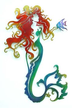 a metal mermaid with red hair and green tail holding a blue fish in its mouth