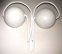 a pair of white earbuds sitting next to each other on top of a table