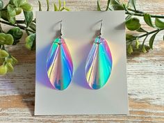 These iridescent teardrop earrings will dazzle you when the light shines through them, while a holographic rainbow will shimmer depending on the background. Holographic earrings are truly unique.  They are super lightweight and are perfect for everyday casual wear. These beauties would also be great for special occasions such as parties, dances, prom, or just a special night out. The holographic nature of these statement earrings make them a fun accessory for both teens and adults.  The nickel f Holographic Earrings, Iridescent Earrings, Earrings Prom, Prom Earrings, Teardrop Earrings, Handmade Earrings, Statement Earrings, Favorite Jewelry, Jewelry Earrings Dangle