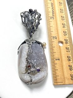 "UNIQUE DRUZY PENDANT Hand-made Sterling Silver , 24 k Gold. Stones used: Druzy, Pearls, Garnet, Amethyst. Height - 78mm, Width - 30mm Unique Handcrafted One-of a-kind Design Pendant Each Piece of Jewelry in my Collection is Absolutely One of a Kind! When you start wearing a piece of my jewelry you will fall in love with it more and more each day and feel that good Energy and Love that I pass into it while creating this piece of Art. A piece of Art created for you to be inspired and love it thro Handmade Luxury Custom Necklace, Fusion Style Necklace With Stone Setting As Gift, Luxury Necklace With Stone Setting For Gift, Luxury Gift Necklace With Stone Setting, Luxury Pendant Necklace With Stone Setting, Luxury Necklaces With Stone Setting For Gift, Luxury Handmade Oval Pendant Necklaces, Artisan Custom Pendant Necklace For Jewelry Making, Luxury Handmade Custom Necklace For Gift