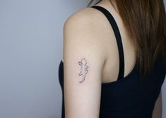 a woman with a small tattoo on her arm