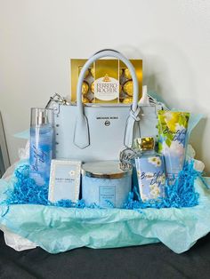 a white purse sitting on top of a table filled with lots of blue and yellow items