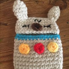 a crocheted phone case with an animal on it