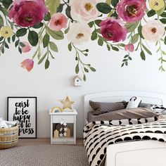 a bedroom with flowers painted on the wall