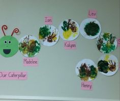 a bulletin board with paper plates that have different types of crafts on them, including caterpillars and ladybugs