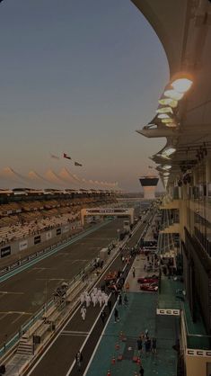 an aerial view of a race track at sunset