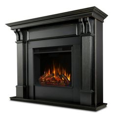 an electric fireplace with a black mantle and fire logs on the sides, in front of a white background