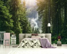 a bedroom with a forest scene wallpaper mural