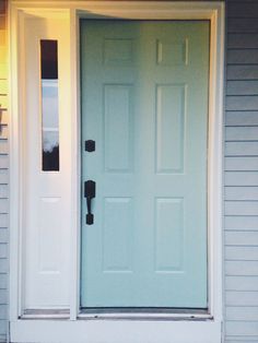 a white front door on a gray house