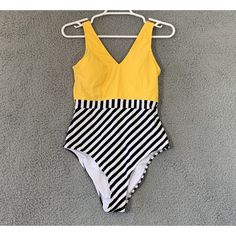 Bust: 36.5-38.5in Waist: 28.5-30.5 Inches Hips: 38.5-39.5 Inches Cup Sizes: 34c 34d 36a 36b Details: Design: Yellow Striped One Piece Swimsuit With V Neck And V Back.Padded Cupsregular Washfabric: 80% Chinlon, 20% Spandex Yellow Lined Swimwear For Summer, Yellow One-piece Swimwear With Lined Body, Chic Yellow Stretch Swimwear, Chic Yellow Swimwear For Spring, Chic Yellow Swimwear For Summer, Chic Yellow Swimwear For Pool, Chic Yellow Swimwear For The Pool, Full Coverage Bathing Suits, One Peice Bathing Suits