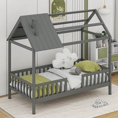 a child's bed with a tent on the top