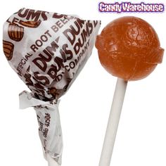 a close up of a lollipop on a stick with wrapper around it