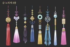 an assortment of tassels and pendants in various colors on a black background