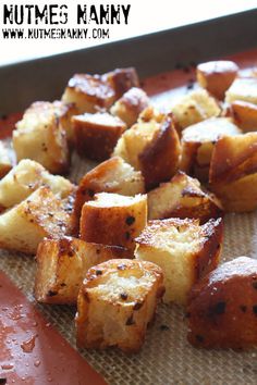 there are many pieces of bread that have been cooked in the oven and placed on a baking sheet