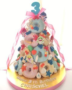 a birthday cake made to look like a doughnut tree