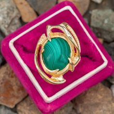 This fabulous bat wing motif malachite ring is centered with one oval cabochon cut malachite set into a bezel. The ring is crafted in 14k yellow gold and is currently a size 6. Malachite Rings, Oval Cabochon, Bat Wings, Bat, Yellow Gold, Yellow, Gold