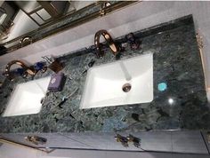 a bathroom with two sinks and mirrors on the wall above them is shown in this image