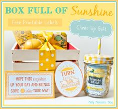 the box full of sunshine is sitting next to other items