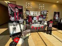 an image of a sports themed display in the lobby for fans to sign autographs