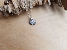 This mini moon necklace features a hand crafted little full moon pendant daintily hanging from a sterling silver cable chain. Each dip & crater is added by hand meaning each moon will be unique. Moon pendant measures approximately 8-10mm diameter Follow this link to enter my shop: https://www.etsy.com/shop/barebranchjewelry Follow these to see some of my other moon options: Bigger full moon necklace: https://www.etsy.com/listing/189944632/full-moon-necklace-moon-phase-necklace Full moon ring Adjustable Sterling Silver Charm Necklace With Moon Charm, Sterling Silver Moon Charm Round Pendant Necklace, Sterling Silver Charm Necklace With Moon Phase Pendant, Sterling Silver Round Pendant Charm Necklace With Moon Charm, Sterling Silver Round Pendant With Moon Charm, Silver Moon Charm Necklace, Silver Round Moon Charm Necklace, Tiny Silver Round Pendant Necklace, Silver Tiny Round Pendant Necklace