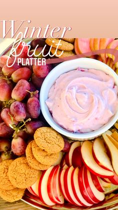 a platter with apples, cookies and crackers on it is featured for winter fruit platter