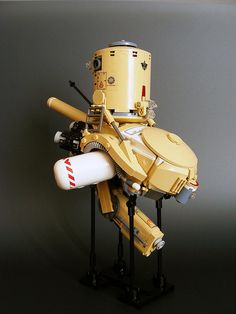 a robot made out of legos sitting on top of a table