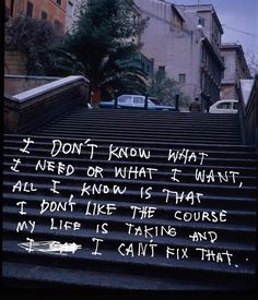 some stairs with graffiti written on them