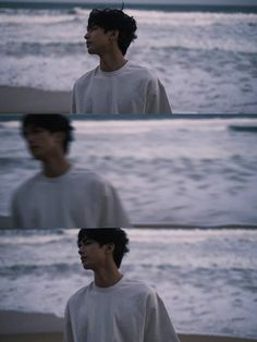 a man standing on top of a beach next to the ocean