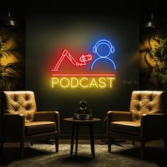 two chairs and a table in front of a wall with a neon sign on it