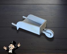 a cartoon figure is standing in front of a cart