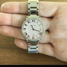 Preowned Women's Watch In Stainless Steel. Pink Dial With Azure Finishing Set With Round Brilliant Diamonds. Tcw .14. 31mm Case Quartz Movement. Water Resistant To 50 Meters/160 Ft/5 Atm. Swiss-Made. Battery Needed. No Original Box. Minimal Wear & Tear On Band, With Two Scratches. Fits 6.5 - 7" Wrist. Can Be Sized Up Or Down. Includes Tiffany Blue Pouch! Qualifies For Poshmark Authentication Service, So Buy With Confidence! Tiffany Watches, Tiffany Atlas, Black Leather Watch, Vintage Tiffany, White Belt, Women Wrist Watch, Diamond Watch, Tiffany Blue, Women's Watch